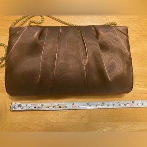 Nina bronze evening clutch bag w/gold shimmer ,gold tone finish chain and clasp.